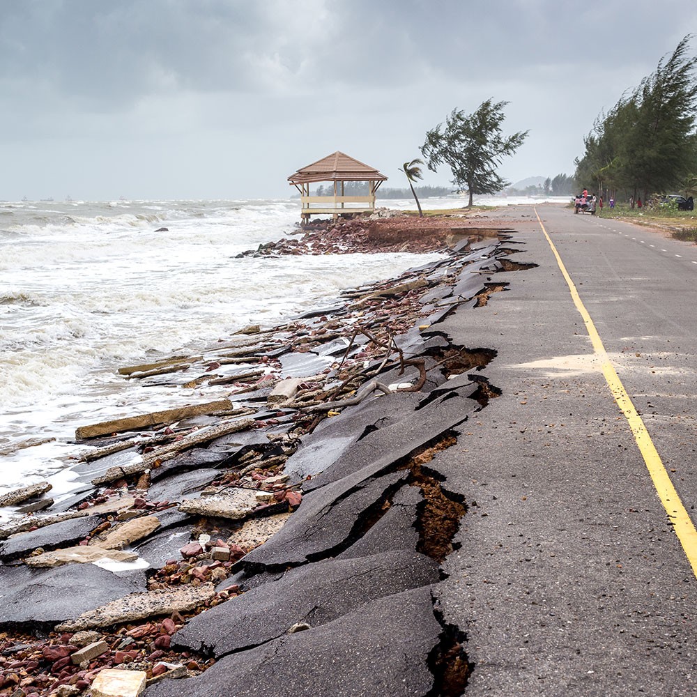Demand Action on Climate Change - Photo of road falling into the ocean