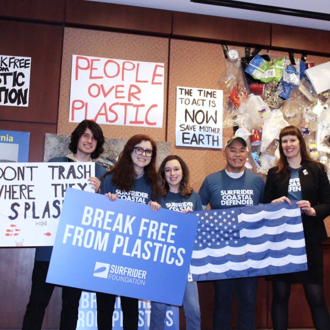 Plastic Pollution - Surfrider activists holding Break Free From Plastics signs