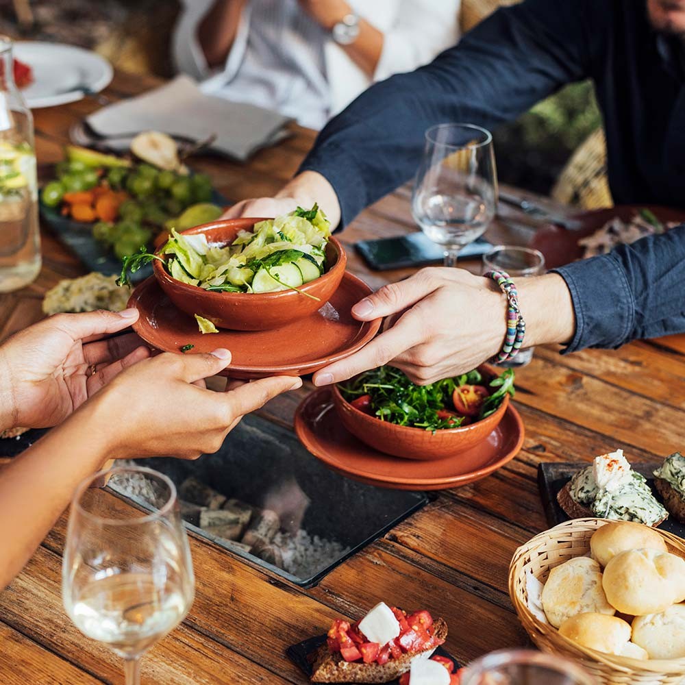 Ocean Friendly Restaurants - Photo of people handing food across a table
