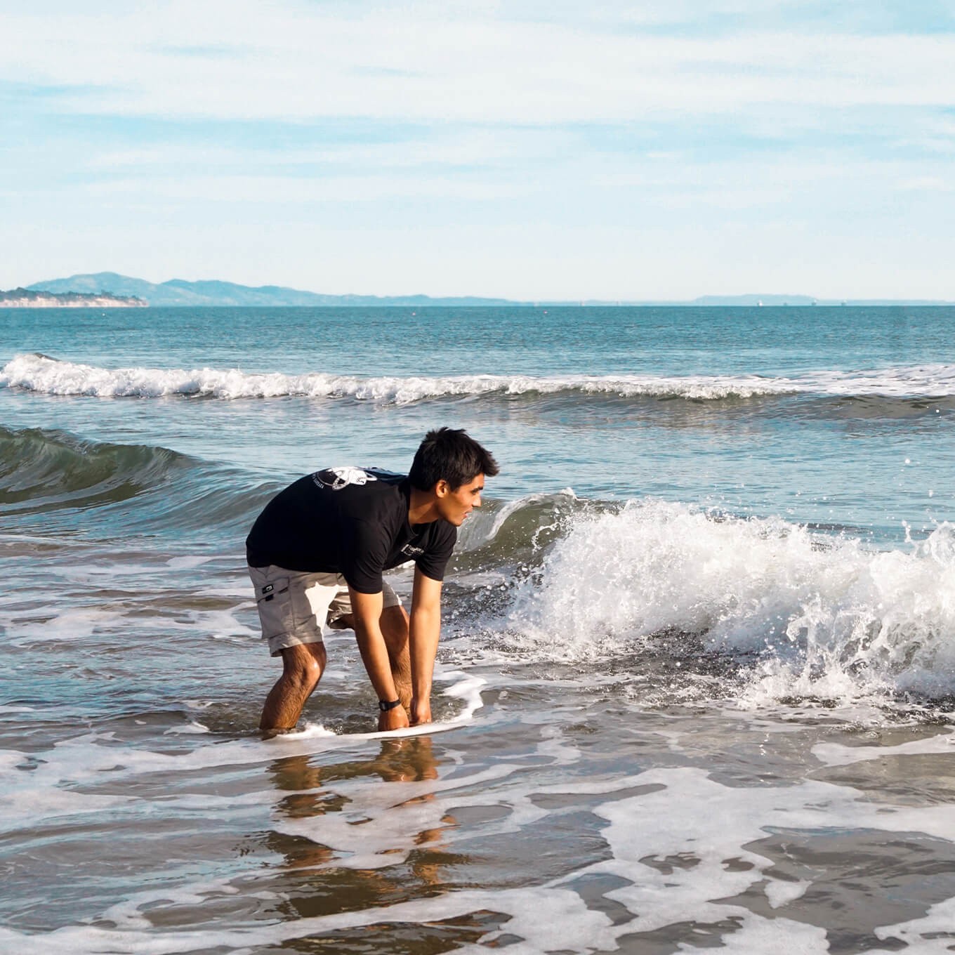photo of a Surfrider volunteer collecting water samples